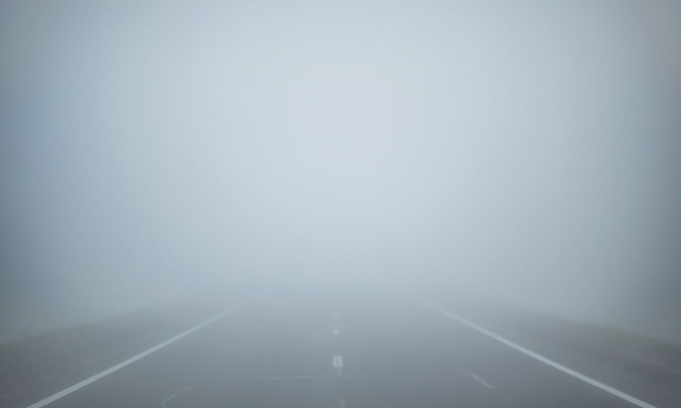 Image of road and deep fog which has reduced clear visibility