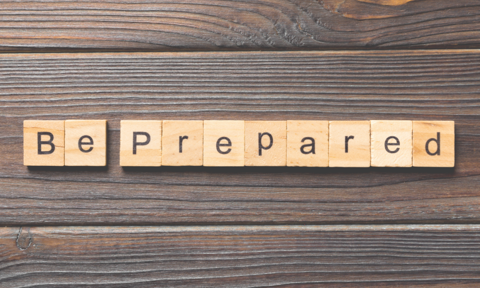 BE PREPARED word written on wood block
